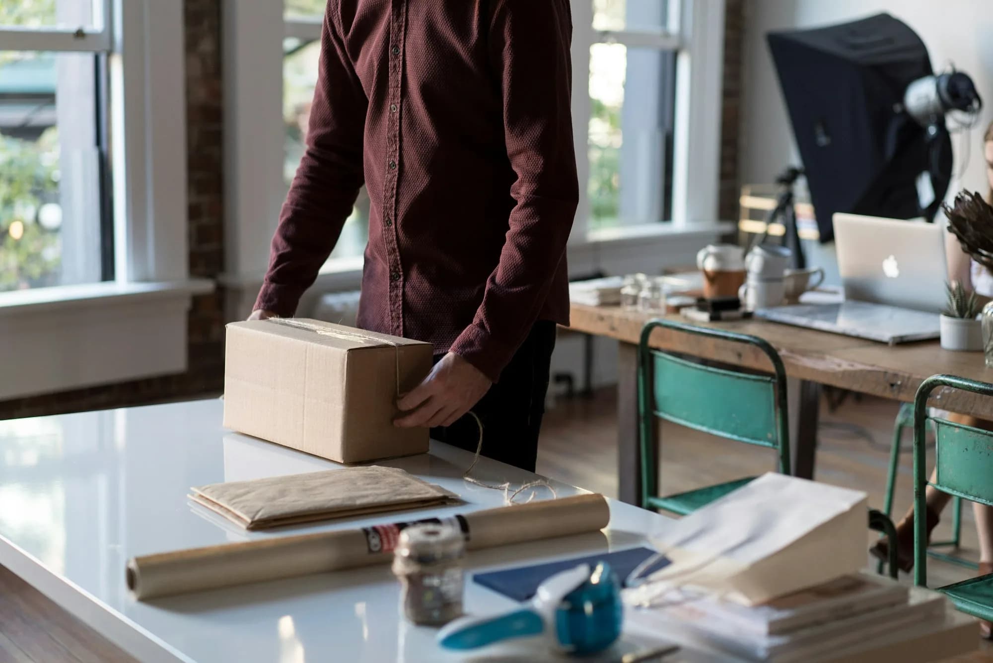 Packing an online order at a bright workspace