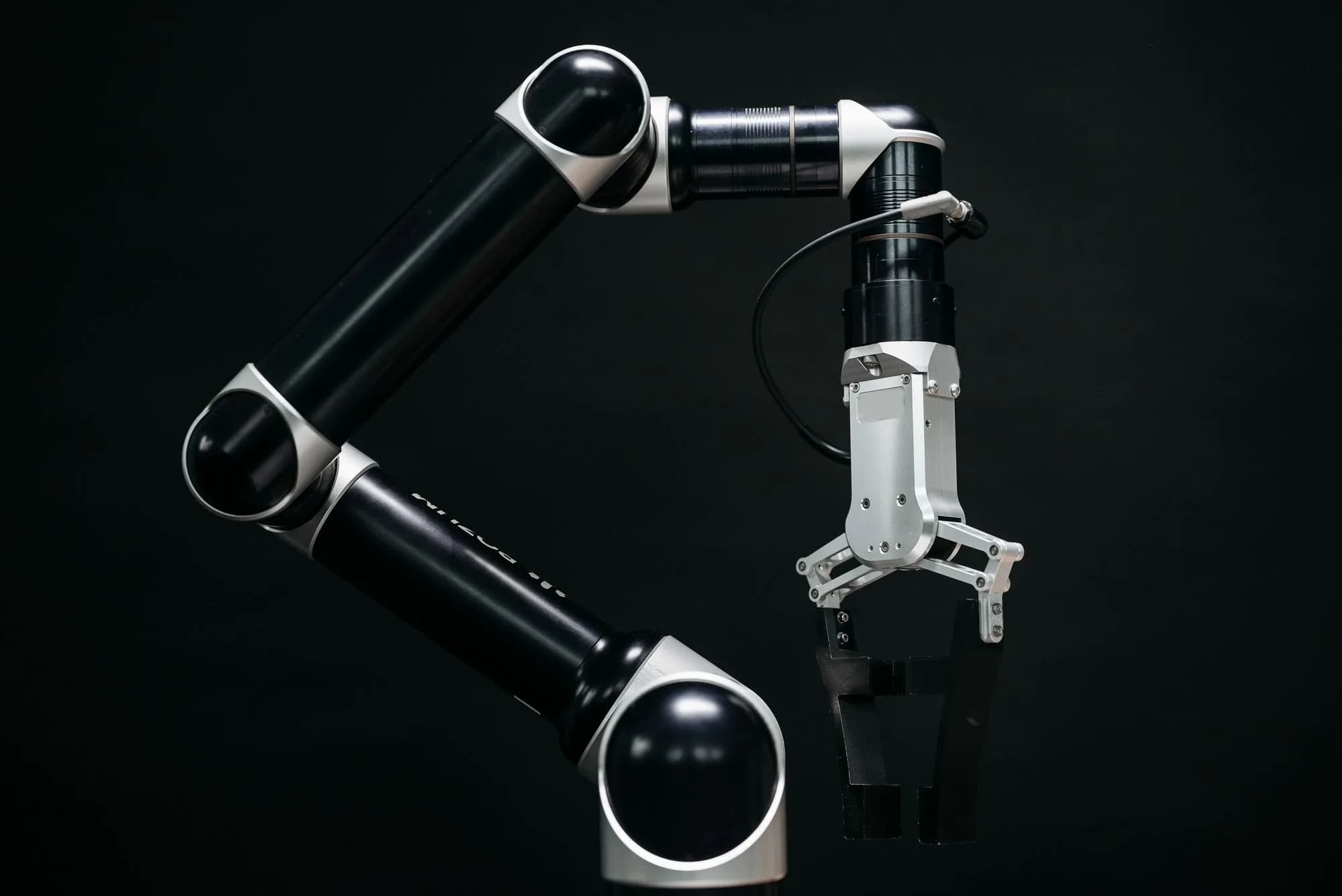Industrial robot arm on a dark background